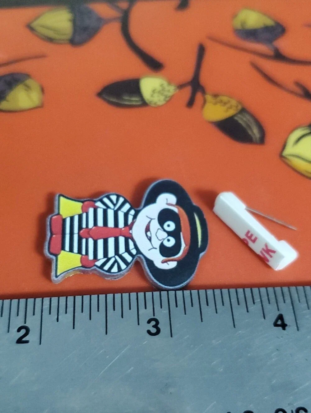 Striped Hamburger Burglar Cartoon Pin - Black, White & Red with Yellow Accent